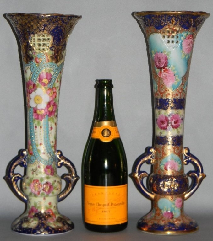 PAIR JAPANESE KUTANI NIPPON TRUMPET MOUTH VASES: Japanese, 19th century hand-painted Kutani, with early Nippon characteristics, Near pair of reticulated trumpet vases with double handles. Both with decoration in under-glaze blue with copious amounts