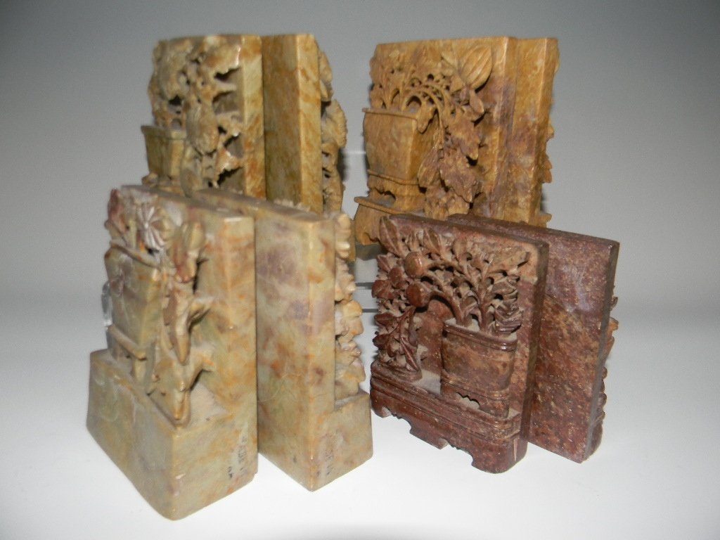 4 PAIR CHINESE CARVED SOAPSTONE BOOKENDS: Four Pairs of Chinese carved soapstone bookends carved with flowers and trees, 19th to early 20th century. Largest: 5.5"h x 4.5"l, Smallest: 4.5"h x 3.5"l. Ref: Soapstone, L-W Book Sales, 1995. PROVEN