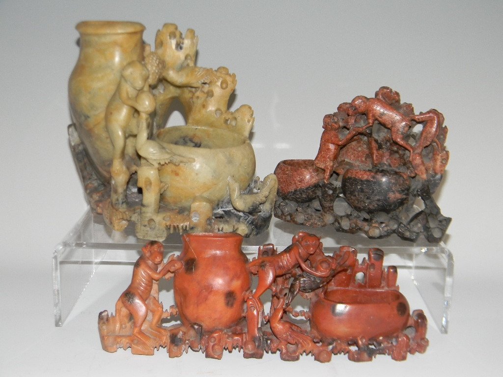 3 CHINESE CARVED SOAPSTONE FIGURATIVE DBL VASES: Three Chinese carved soapstone double vases with monkeys. 1.) Double vase in spotted red soapstone carved with monkeys and birds, 3.25"h x 9"l. 2.) Double vase in mottled red and black soapstone carve