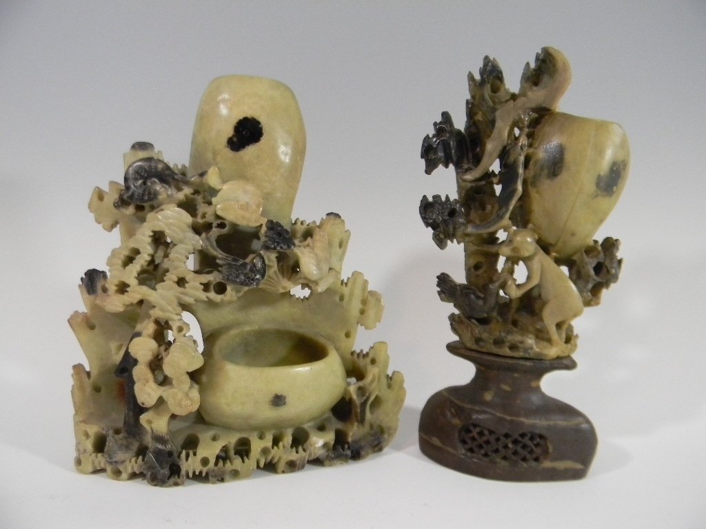 2 CHINESE CARVED SOAPSTONE FIGURAL VASES: Two Chinese carved soapstone figurative vases. 1.) Attached two piece pedestal vase with a monkey feeding a bird and two lucky bats flying above carved into spotted soapstone, label on base reads "190