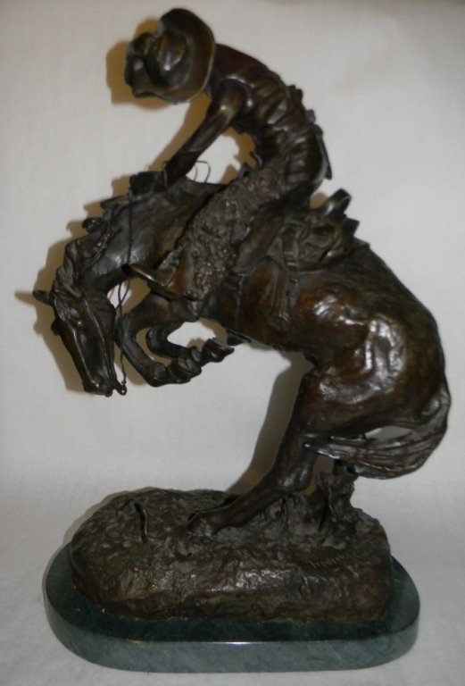 AFTER REMINGTON RATTLESNAKE BRONZE SCULPTURE: Vintage bronze sculpture after Frederic Remington 1861 â€“ 1909, America), "The Rattlesnake" depicts the moment a cowboy's trusted steed shies away from a defensive rattlesnake. A very good casti