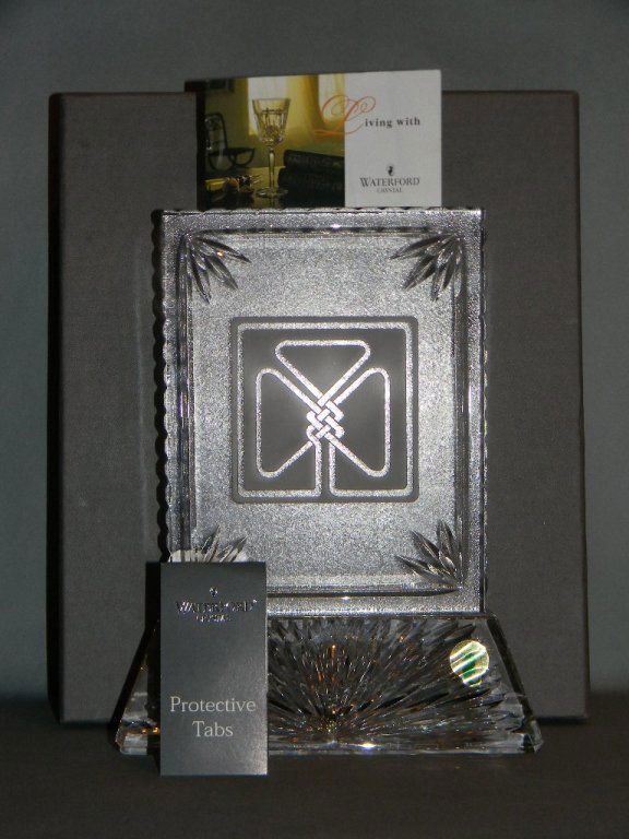 WATERFORD CRYSTAL SHAMROCK PEDESTAL PLAQUE: Stunning piece of Waterford crystal, with a deeply etched Celtic knot in the shape of an Irish Shamrock. The Waterford etched makers mark on the base and with foil label, 9.25"h x 7.25"w.
