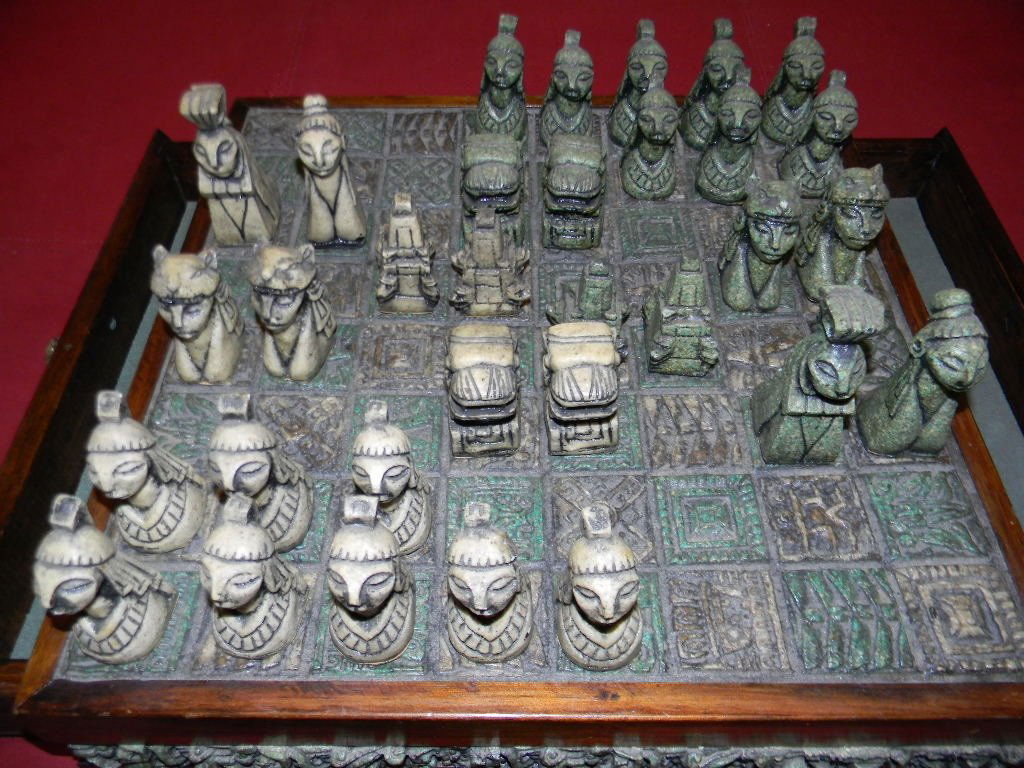 VINTAGE AZTEC CHESS BOARD & PIECES ATT. ZAREBSKI: Vintage chess set chess, made in Mexico with an Aztec theme, c. 1960-70. Board with two drawers on opposite sides for storage of pieces. Board and and pieces created from crushed and molded stone with