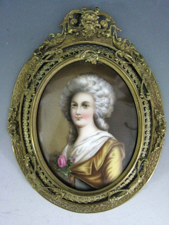 SIGNED PORCELAIN PLAQUE MARIE ANTOINETTE: Hand-painted, oval porcelain plaque depicting Marie-Antoinette with powdered hair and a pink rose at her bosom, illegibly artist signed lower right edge, with original paper label on bisque back, plaq