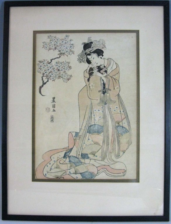 JAPANESE WOODBLOCK PRINT GEISHA AND CAT: Japanese woodblock print of a woman holding a cat and wearing a kimono decorated with fans. Sight size: 13.5"h x 9.375"w; Framed: 20.75"h x 15.625"w. Also found in the Harvard Art Museum Accession Num