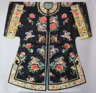 CHINESE EMBROIDERED BLUE SILK BUTTERFLY ROBE: CHINESE EMBROIDERED BLUE SILK ROBE, QING DYNASTY: The body in deep blue silk with yellow cuffs, the whole embroidered with scattered butterflies, prunus, chrysanthemums and other flowers in silk