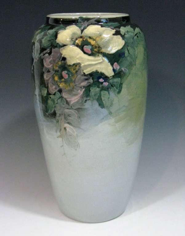 WELLER EOCENE VASE WITH WILD ROSES 9"H.: WELLER EOCENE VASE WITH WILD ROSES 9"H.: Hand painted with roses on a soft green-grey ground, unmarked. PROVENANCE: Our consignor had a family member who worked at a pottery in the Zanesville area, al