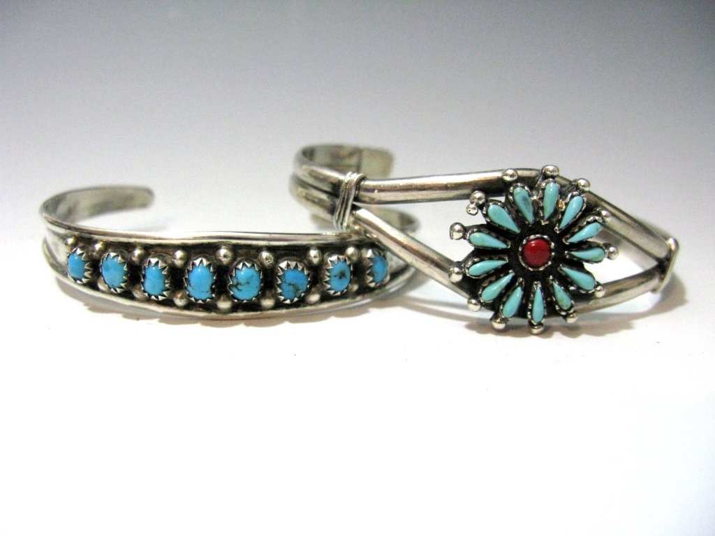 2 VINTAGE ZUNI STERLING & TURQUOISE CUFF BRACELETS: 2 VINTAGE NATIVE AMERICAN ZUNI STERLING & TURQUOISE CUFF BRACELETS: 1. With a central rosette saw-tooth mounted with a round coral cabochon surrounded by turquoise teardrops, .875"h x 5.75" inside len