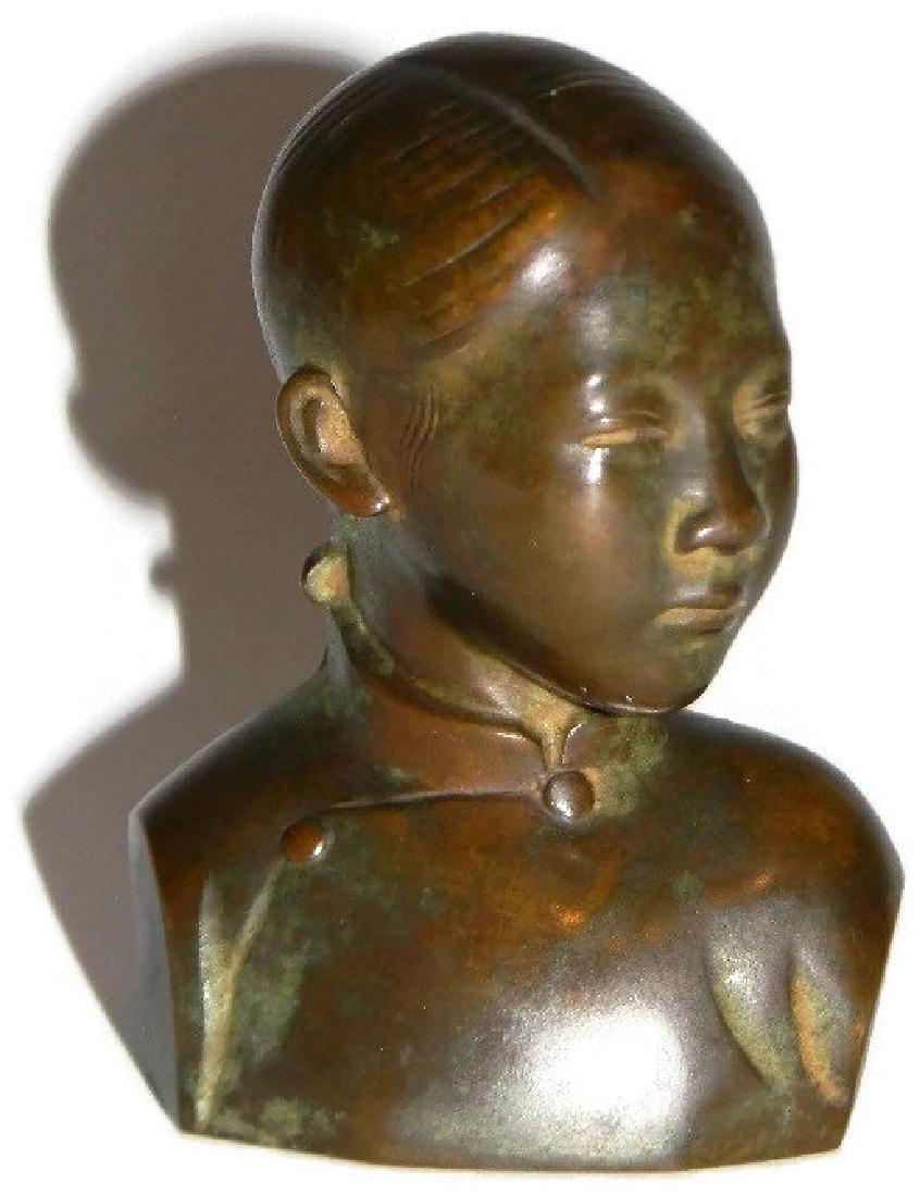 SIGNED FRENCH INDOCHINA BRONZE BUST OF A GIRL: SIGNED FRENCH INDOCHINA BRONZE BUST OF A GIRL: c. 1940, French Indochina (Indochina included: Cambodia, Laos, and Vietnam ) Bronze bust of a young girl, etched D-C and INDOCHINA, 4.5”h.