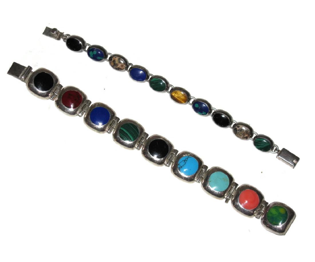 2 TAXCO SIGNED INLAY .925 CUFF BRACELETS: 2 TAXCO SIGNED INLAY .925 CUFF BRACELETS: 2 Taxco, Mexico, 20th century link bracelets, each inlaid with gemstones including: Turquoise, Malachite, Azure-Malachite, Tiger’s Eye, Onyx, Agate, Azurite