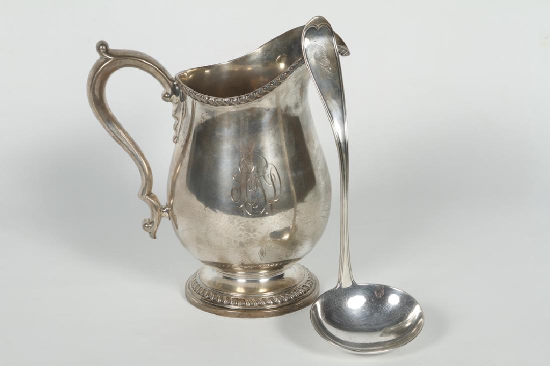 J. E. Caldwell & Co Silver Water Pitcher & Ladle: Late 19th and early 20th century, Philadelphia. Pitcher with elegant form and detail. Ladle is large with fiddle handle. Each bearing monogram A D duPont. Good condition no dents or repairs to speak o