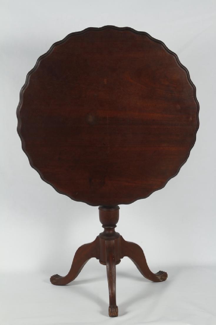 Chippendale Style Mahogany Tilt Top Table: 19th century. Shaped circular top on urn shaped pedestal emitting cabriole legs with paw feet. H30 1/4" Dia30" Collection of a South Carolina Gentleman.