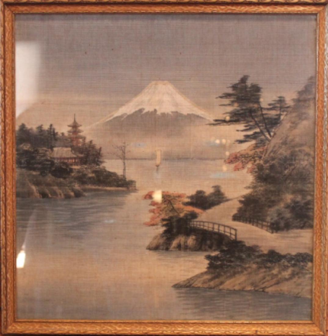 Antique Japanese Needlepoint Picture: Mid to late 19th century. The picture of a volcanic snow capped mountain at a lakeside all in hand stitch or woven detail, unsigned. Some slight stains to fabric but overall good condition. H 21 3/4"