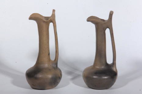 Near Pair Southern Native American Pottery Pitcher: Circa 1930, Catawba, York County, South Carolina. Each in the ewer form, unsigned. Some surface wear and firing flaws. H11"