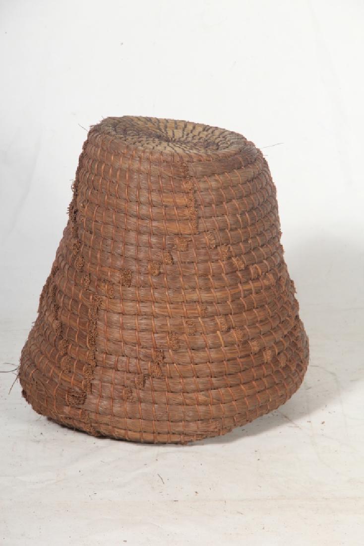 Antique Woven Pine Straw Beehive: Late 19th/early 20th century, likely South Carolina origin. The hive is entirely crafted from woven pine needles and grass. Good sturdy condition the piece does not look to have been used. H19"