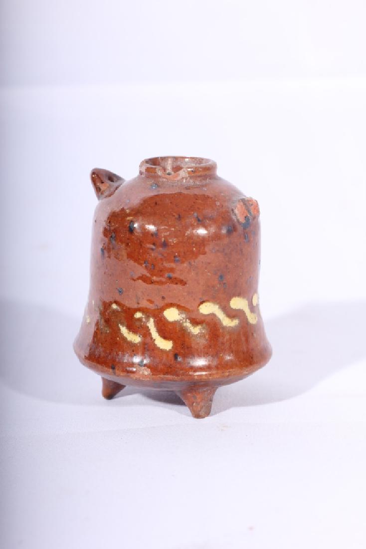 Early Redware Decorated Flask or Inkwell: 18th century, America or Britain, possibly Moravian. The piece having a led glaze with an interesting bell-shape form. The bottom is slip decorated around the perimeter. A chip to the spout and some p
