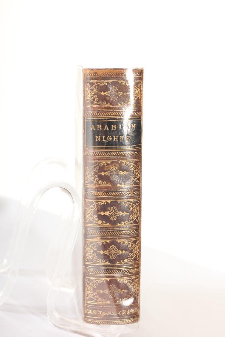 Antique Book Arabian Nights Leather Bound Volume: 1866. A new edition in one volume. London George Rutledge and Sons, Broadway, Lidgate Hill, New York: 129, Grand Street. Good overall condition. Binding in very good condition.