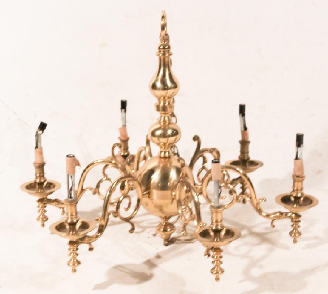 English Brass Six Light Chandelier: Mid 20th century. Having a spun brass center emitting six scrolling arms. Good condition. H22" W30" Sold from a private Charlotte, North Carolina collection.