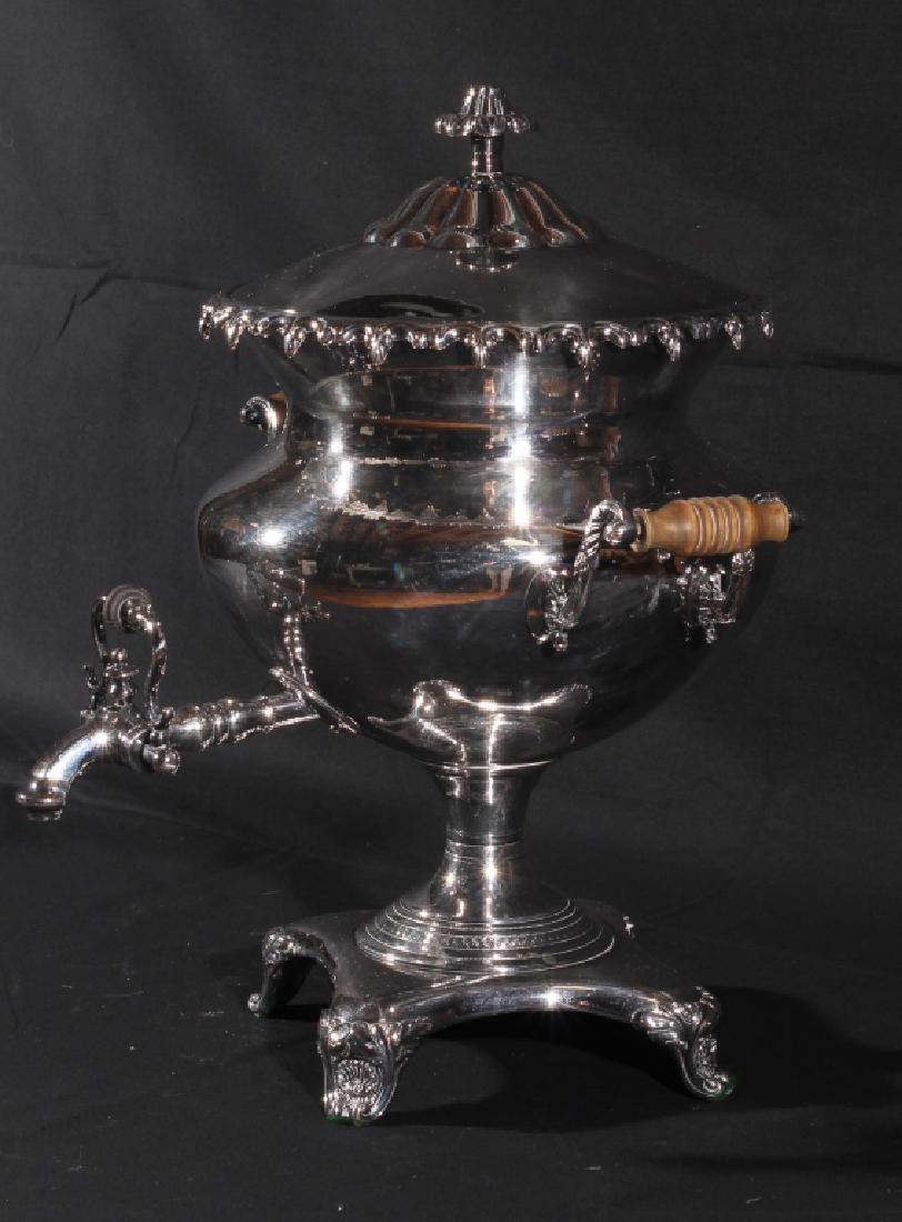 British Antique Sheffield Plate Hot Water Urn: Mid 19th century. Excellent form with well-detailed acanthus body and handles at each side. Marked at the base with what looks to possibly be the makers name in script. Very good condition. H17 3/4" S