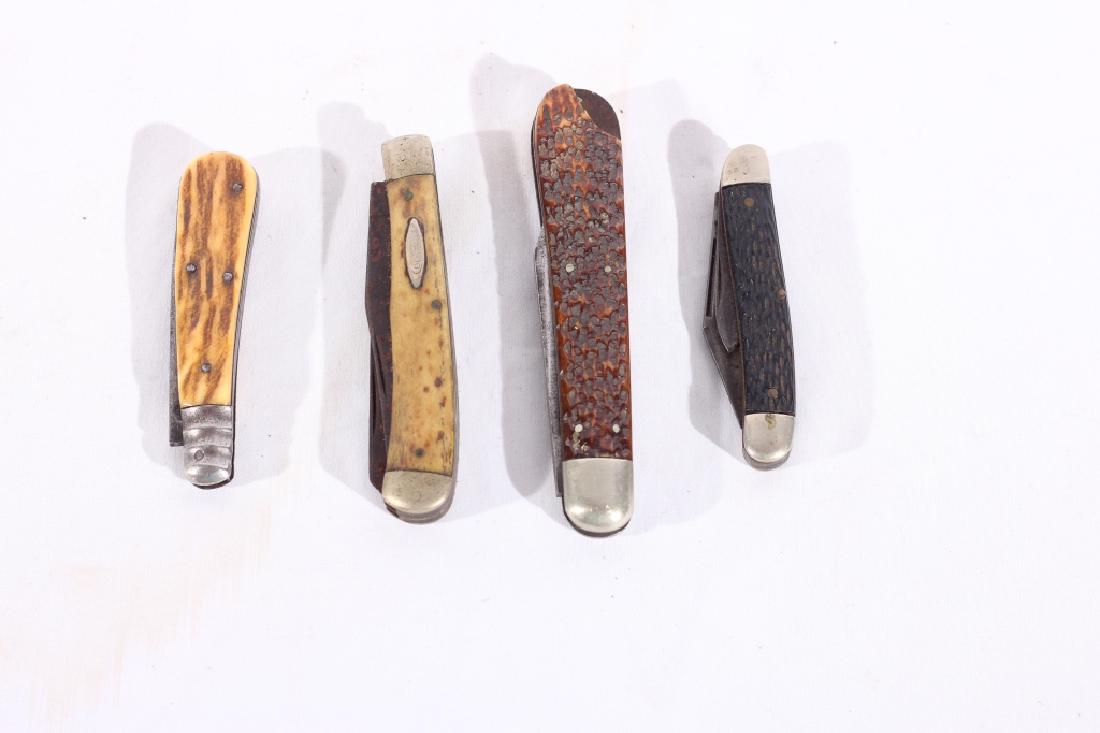 Collection Antique Pocket Knives: Early 20th century. Including three knives. One Lamb foot bone handled pocket knife another by Bower and a switchblade by the Press Button Knife Company of Walden New York and what looks to be a small