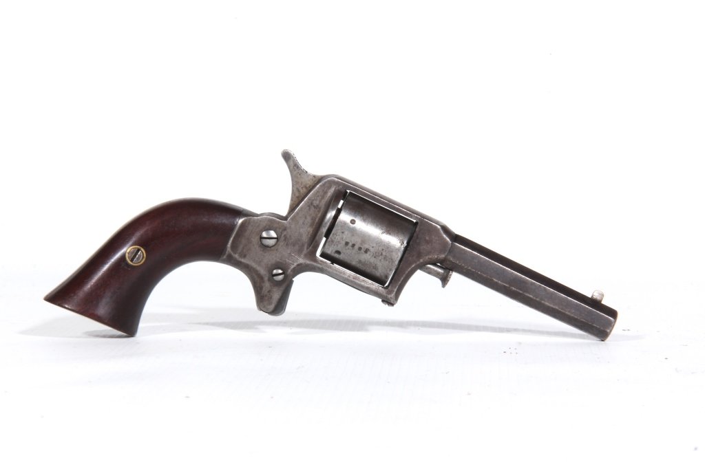J.P. Lower .32 Caliber Pocket Revolver: Circa 1860. Having octagonal barrel and early, likely original, mahogany grip. Marked with serial number 3852 at the barrel, cylinder and base of the grip. Old surface pitting consistent with age and 