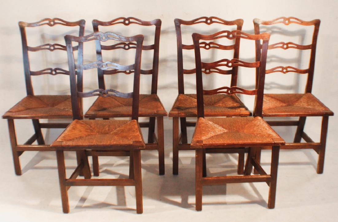 Set Six British George III Mahogany Dining Chairs: Last half of the 19th century. Each having a shaped and pierced back with rush seat atop square legs. Good sturdy condition. H37" W20" D17" Sold from the collection of a Rock Hill South Carolina coupl