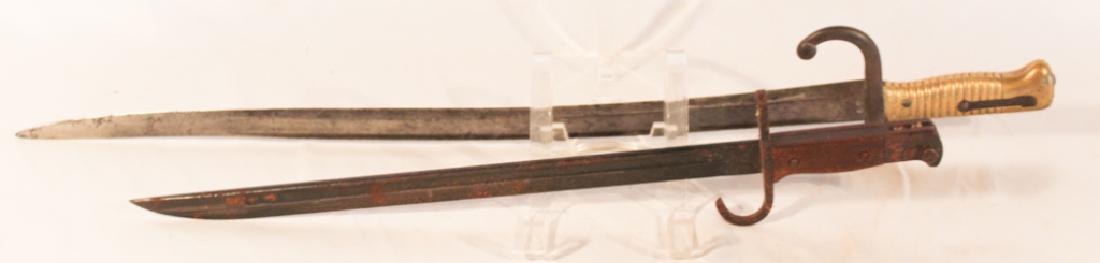 Two Antique Bayonets: One 19th century and the other early 20th century. Each having makers marks on the blades. L27" L20" Sold from the collection of a private Aiken, South Carolina family.