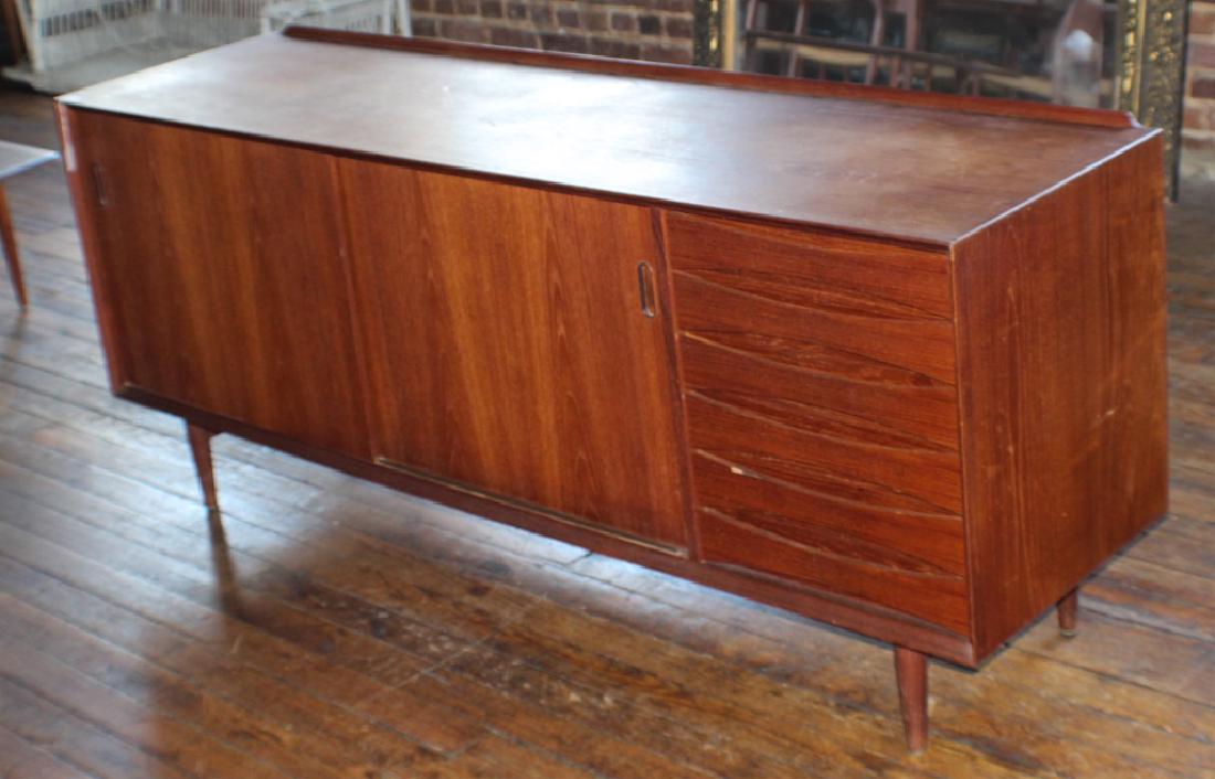 Danish Modern Teak Wood Sideboard by Arne Vodder: ÒSibast FurnitureÓ marked at the interior. The handsome piece having an excellent form with makers mark at the interior left side of the case. Good condition. H29 1/2" W73" D19 1/2" The piec