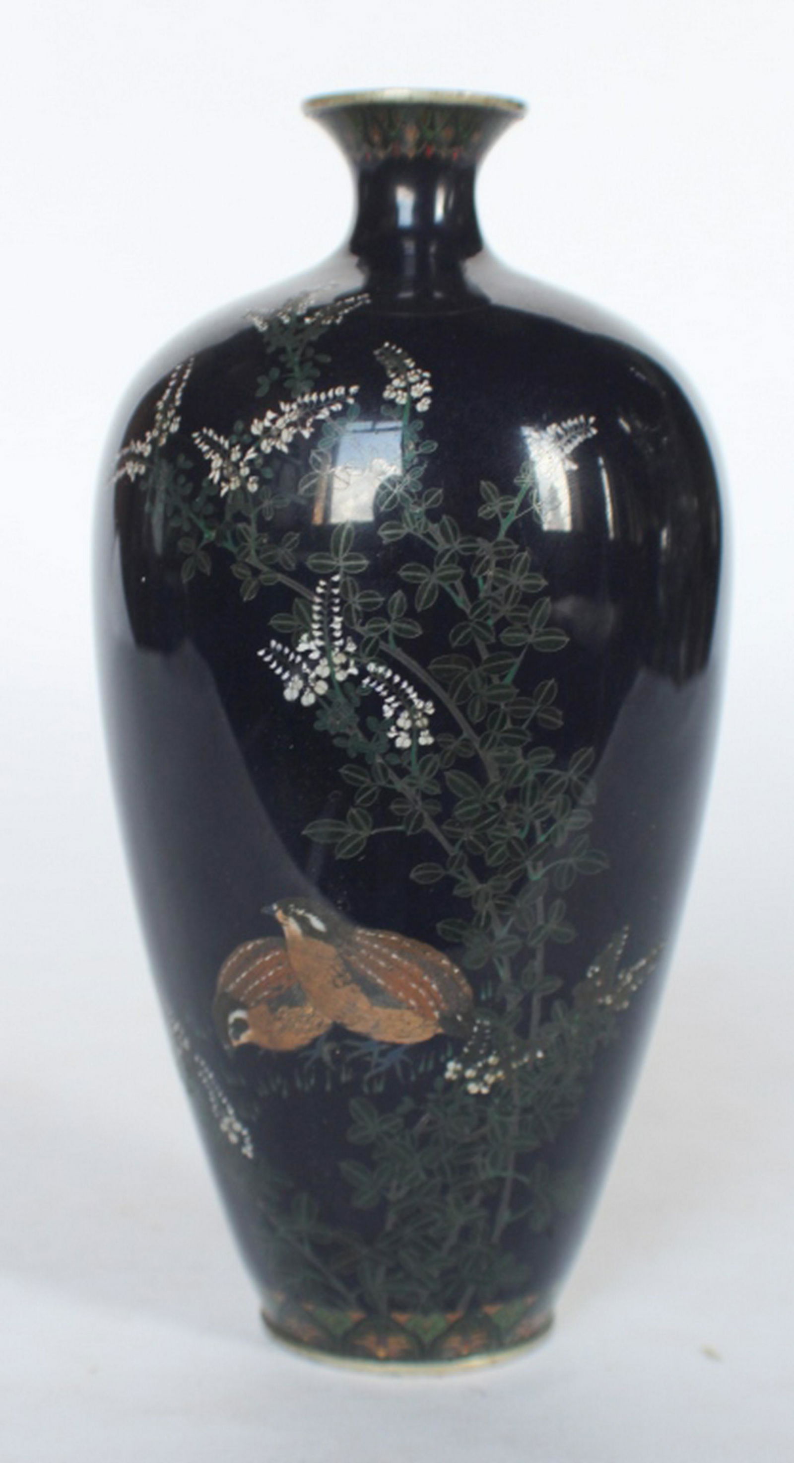 Very Fine Meiji Japanese Cloisonne Enamel Vase: 19th century, possibly Imperial. Exceptionally detailed piece featuring quail amongst fauna with a deep blue ground. Marked at the base with chop mark. Good condition throughout. H7 1/2" Sold from the
