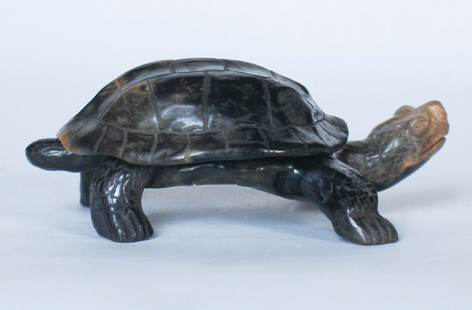 Catawba Pottery Figural Piece by Eric Canty: 21st century. The figural piece in the form of a turtle with a removable shell. Signed at the base of the body and interior of the shell. Good condition. L6 1/2" Sold from the personal collection of M