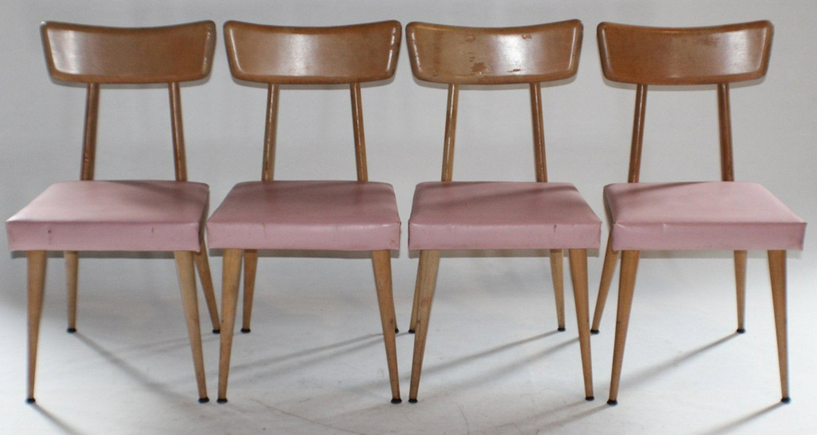 Set Four Mid Century Chairs by Heyward Wakefield: Mid 20th century. Having a bleached maple frame with pink upholstered seat. Sturdy condition having original makers label on base. H32 3/4" W17 1/2" D18 1/2" Sold from the collection of an upstate Sou