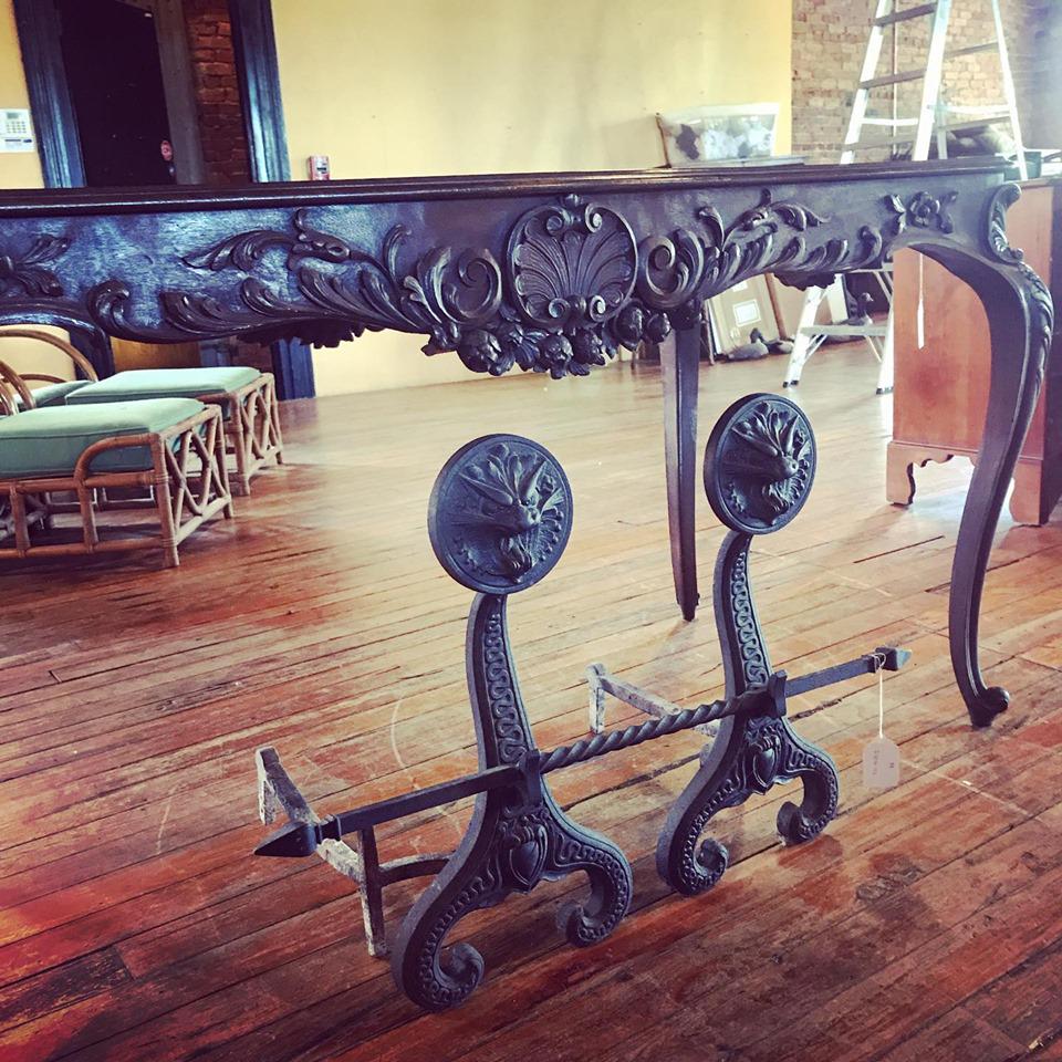 Quality Pair Bradley & Hubbard Iron Andirons: Circa 1880. Having excellently cast form of griffon or serpents head with serpent body in relief at the front of the irons. Connected by a rod at center with points at each end. Good condition signed 