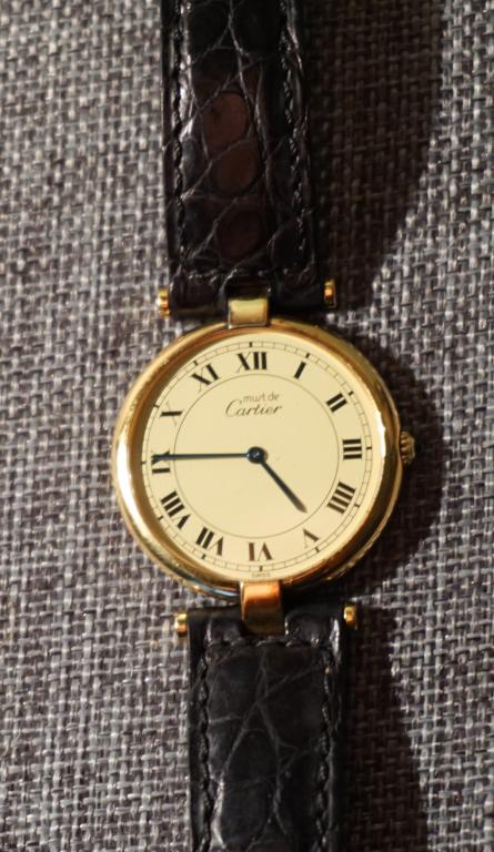 Cartier Ladies Argent Plaque Gold Wrist Watch: Gold over Silver .925 case in very good condition throughout. Serial number 124038 on verso and having four well defined hallmarks. Band is also Cartier. 24 grams all in Property of a Southern Lady Al