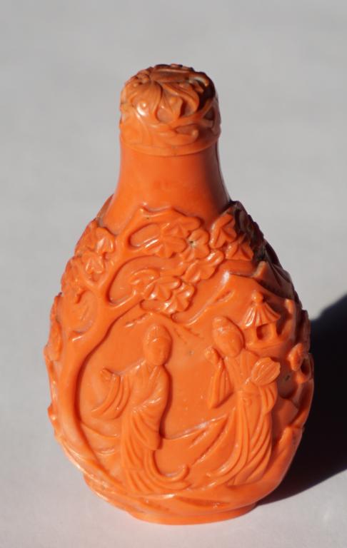 Very Fine Antique Chinese Carved Coral Snuff Bottl: 19th century, Qing Period. Exceptionally carved example having figures at each side amongst landscape and with a very nicely carved top as well. Good condition throughout. H4" W2 1/2" D1" The piece ha