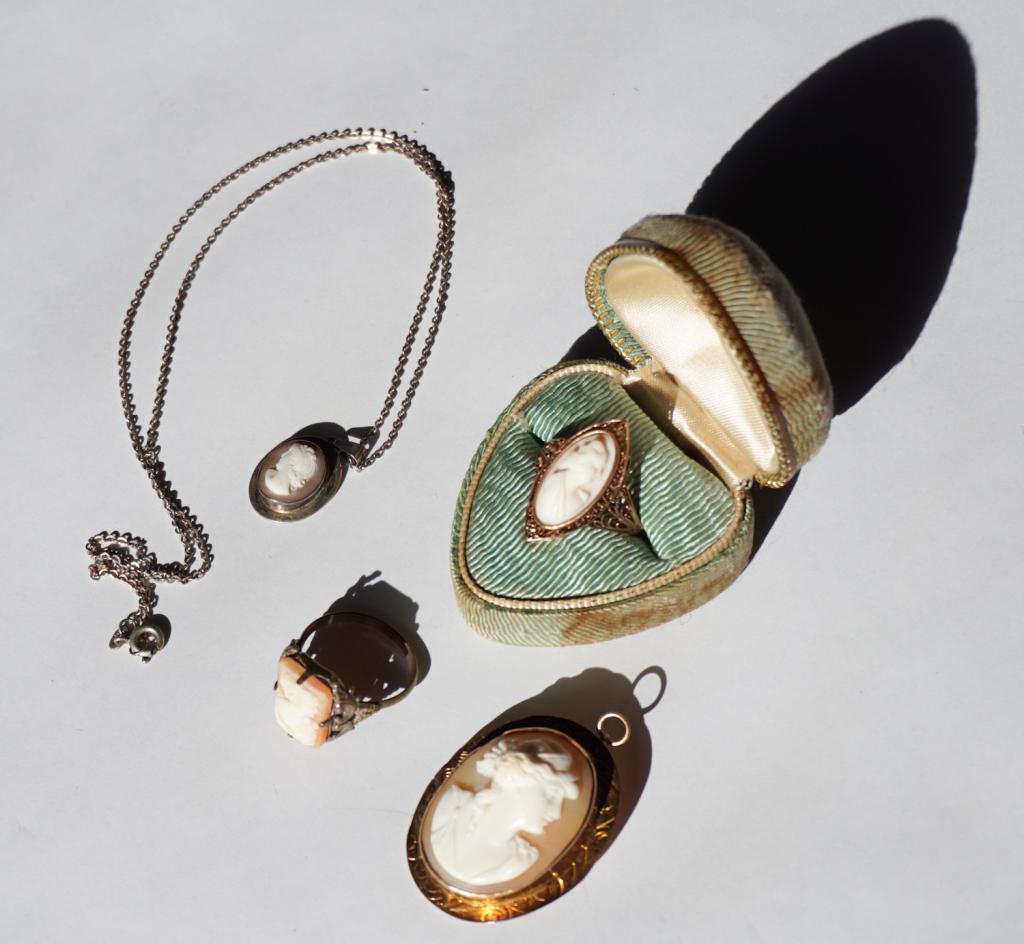 Antique Victorian Shell Carved Cameo Jewelry: 19th and early 20th century. The group includes a gold filigree ring with oval cameo along with a pendant also in gold along with a smaller pendant and antique ring in silver. Property of a Columbia l
