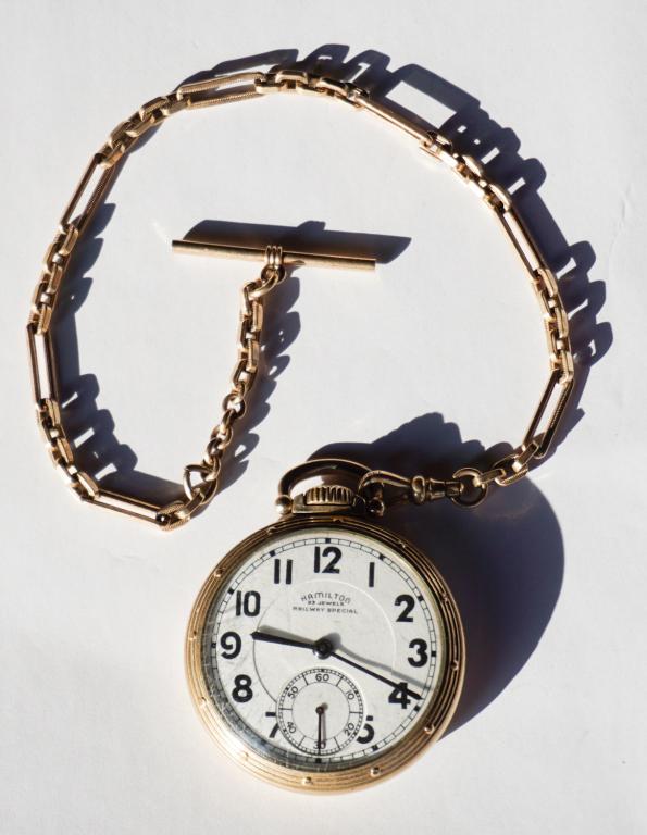 Hamilton Railway Special Pocket Watch, Chain & Fob: 23 jewels. Having a nicely preserved dial, the case is 10k gold filled. The chain marked ÒSimpson 10-12kt gold filledÓ. Marked at the interior with number K241803. All jewelry lots in this sale have