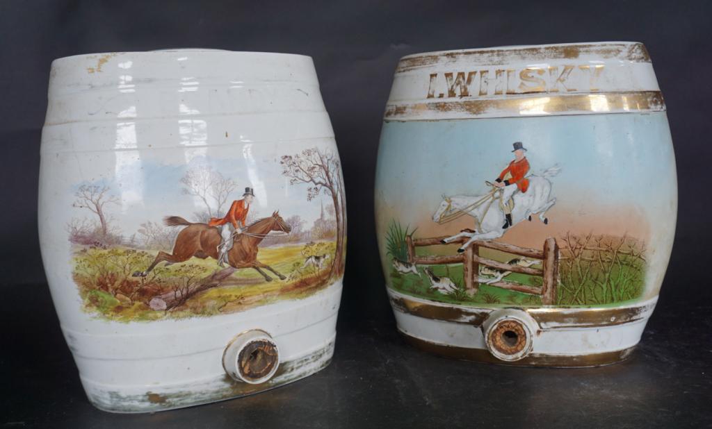 Pair English Porcelain SportingTheme Drinks Cooler: Mid to late 19th century. Each having handsomely decorated body with huntsman on horseback walking hounds in British countryside. Painted surface having some wear consistent with age and use. Lid of o