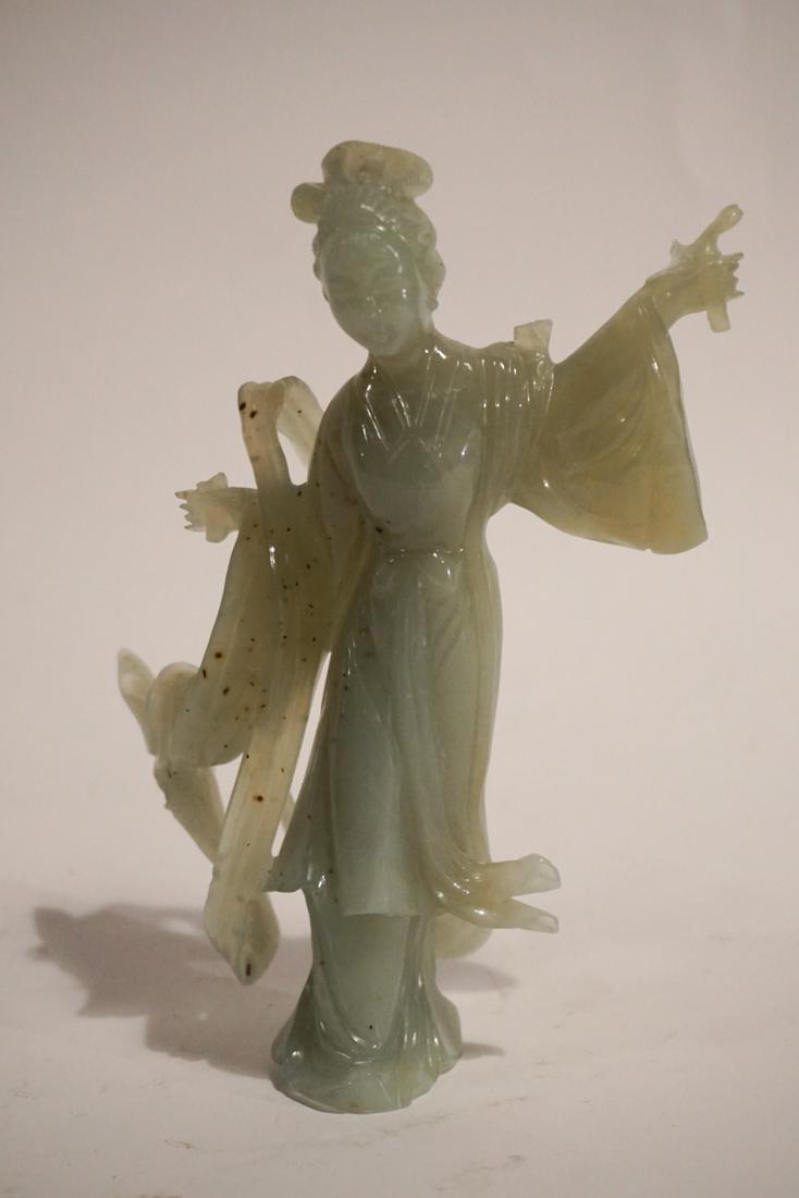 Vintage Chinese Carved Jade Figure of Quan Yin: Likely early 20th century. Having a spotted celadon color. The piece is nicely carved and has excellent details. The tip of the scroll in the hand of the figure is chipped away and one repair to the u