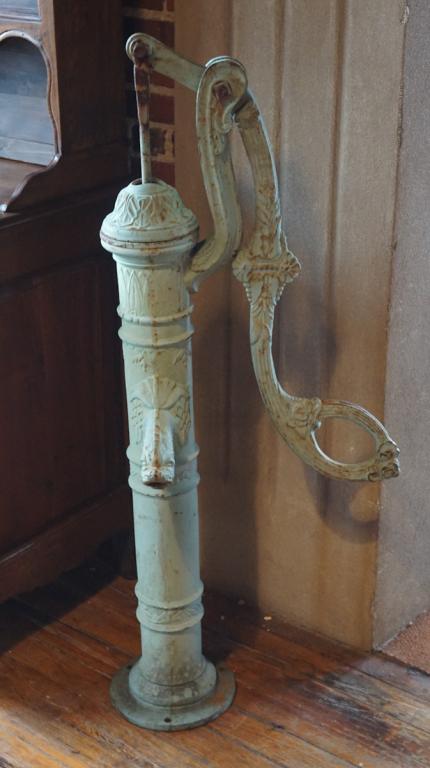 Fine Antique English Cast Iron Garden Well Pump: 19th century. Having a classical form with nicely shaped body and pump handle. The spout in the form of a neoclassical dolphin. Good condition early painted surface. H51 1/2" Sold from the collection