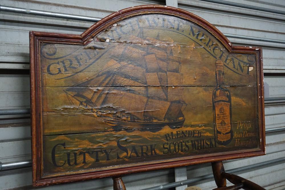 Vintage British Tavern Sign: Likely mid 20th century. The piece is nicely painted with ship and bottle of whiskey. Some shrinkage to the joints. W36 3/8" H23" Sold from the collection of Mrs. Joanne Pirkle of Buckhead, Atlanta.