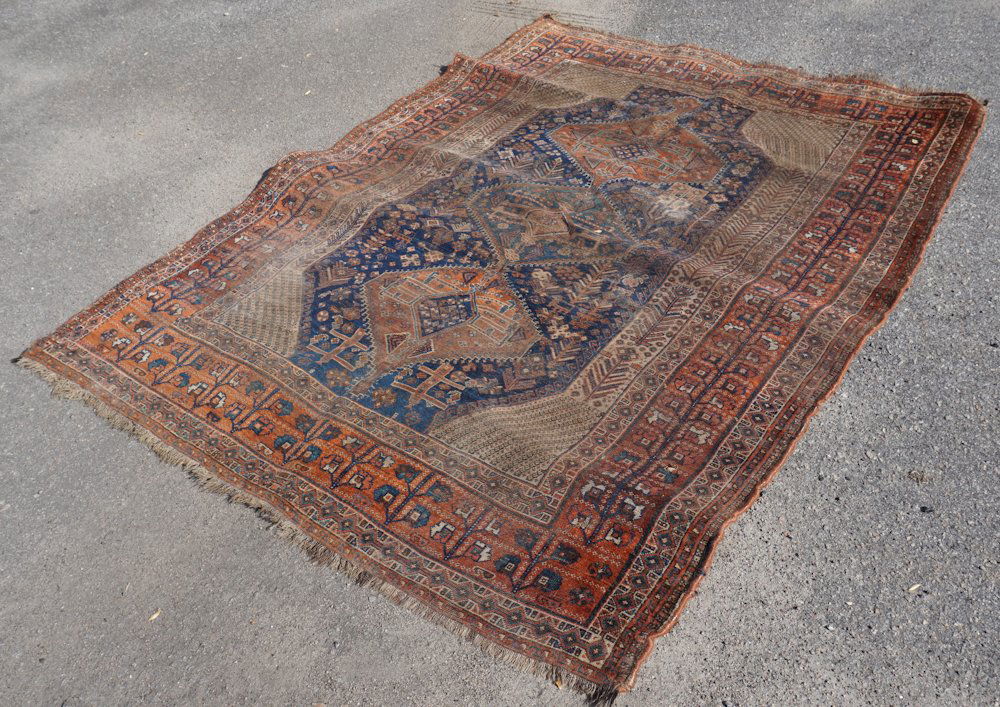Antique Persian Tribal Carpet: Early 20th century. The piece has been backed with knap cloth or fabric.95" W 69"