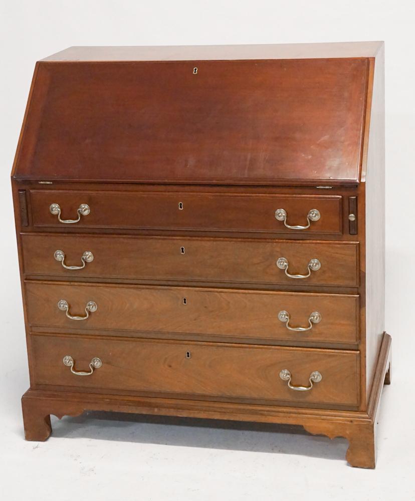 British George III Mahogany Slant Front Desk: Circa 1790. Having a hinged fallfront opening to very nicely carved and appointed interior boasting a shell carved center drawer atop four slightly graduated drawers on a bracket foot. H41" W37" D22"