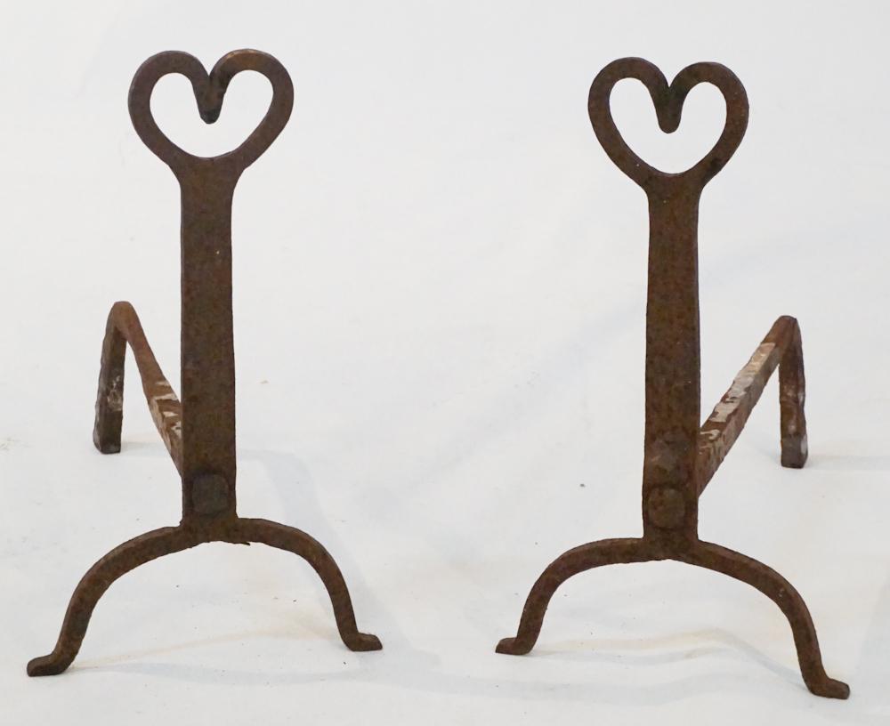 Pair Antique Backcountry Wrought Iron Andirons: Mid 19th century, possibly South Carolina. The tops in the shape of a heart atop base with mortised log support. H18" W11" D16" Sold from the personal collection of Mr. Steven Ferrell of Edgefield, So
