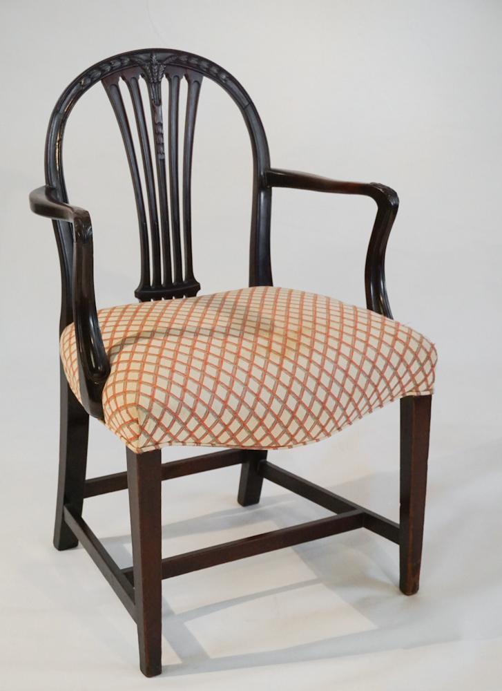 British George III Carved Mahogany Armchair: Circa 1790. Having a carved back centered by grain or rice carved center leading down to arms that continue down to lower frame supported by four tapered legs. H37" W23 1/2" D18" Sold from the collect