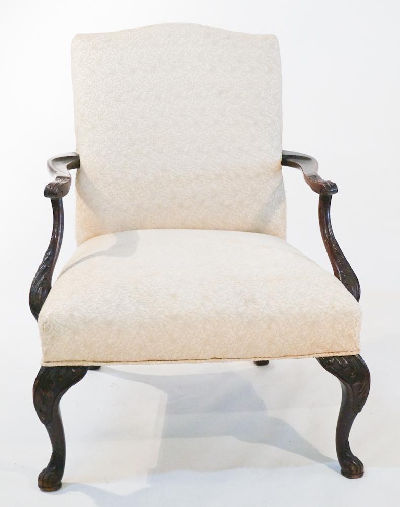 Fine George III Style Carved Mahogany Open Arm Chair: Likely mid 19th century, Britain. The piece having a nicely formed frame with upholstered back and seat flanked by acanthus carved arms continuing down to well carved legs. H38" W30" D35" Sold from th