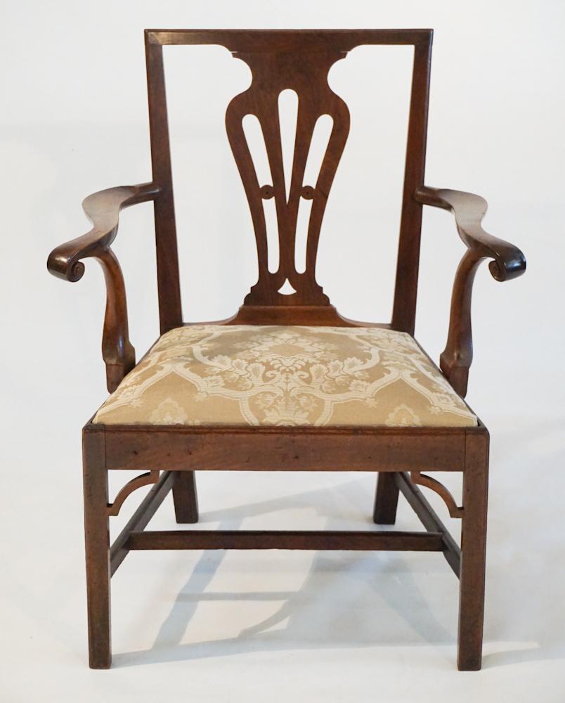 Handsome Chippendale Mahogany Armchair: Circa 1770, Britain or America. Having a very nicely pierced and shaped back leading down to brilliant and boldly carved arms above the upholstered seat leading down to square legs. H36 3/4" W38 1/2" 