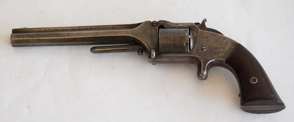 Very Fine Smith and Wesson 1860 .32 Cal Revolver: Old model Army Revolver rim fire .32 cal. Very handsome gun having original wood grip and nice surface. Numbered 42986.
