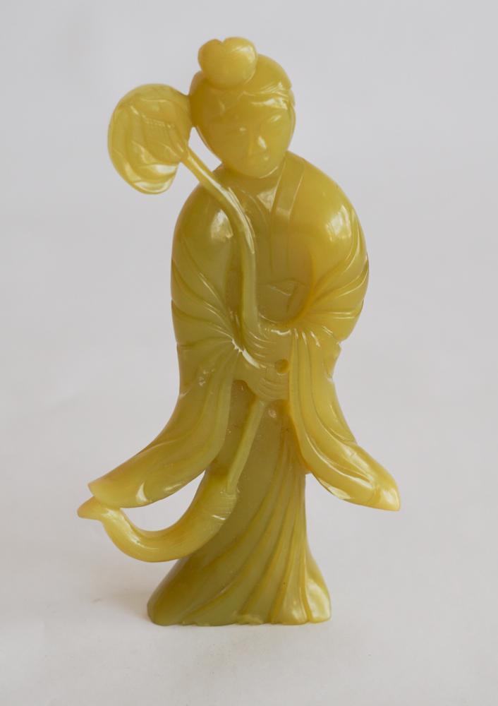 Vintage Chinese Jade Standing Figure: Early 20th century. Slightly yellow jade figure of standing woman with lotus flower in her hands. The piece has well detailed hair and nice elegant lines. No breaks or restoration detected. H6 1/2" So