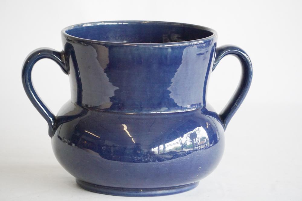 Swedish Turned & Glazed Art Pottery Eldfast Vessel: Mid 20th century. Having a nice deep blue glaze and well formed body and handles. Very shallow glaze flake to the rim at backside and near handle. Marked at base with makers mark. H7 1/2" W11 1/2"