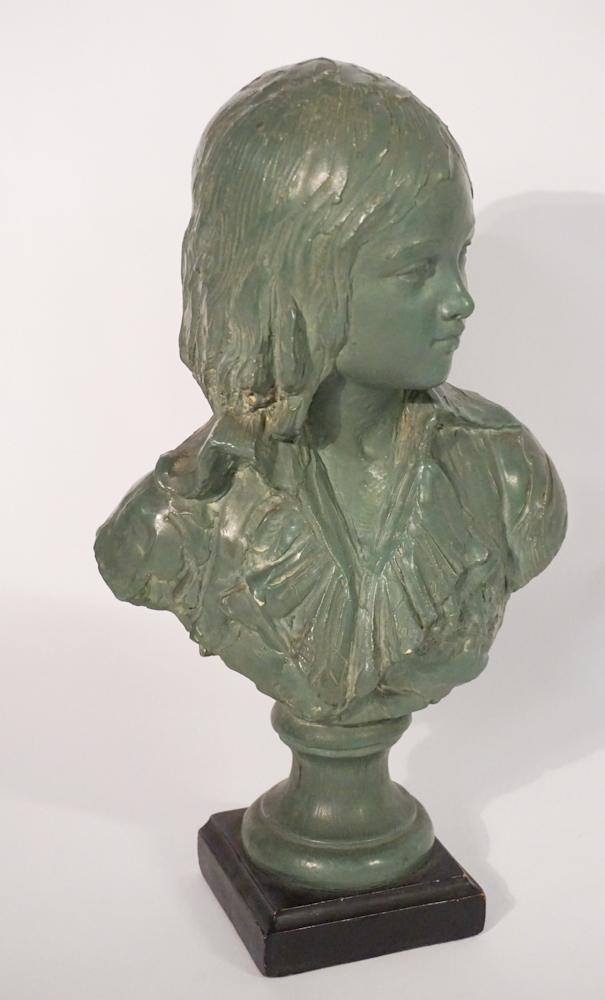 American or British School: Likely early 20th century. Bust of a lady in hand sculpted plaster or chalk which has then been cold painted green. The back shoulder is signed but illegible. The piece bears the label of Borghese at